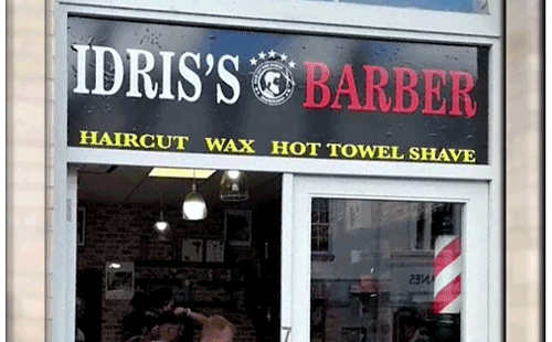 Idris Barbers' logo for traditional and modern haircuts in Newtown.