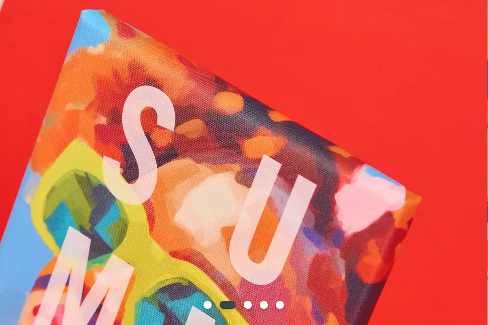 A photo of a canvas print taken from the top so you can see how the canvas wraps around. Set against a vibrant red background.