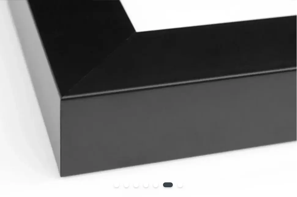 The corner of a black photo frame in the foreground shows the quality of the workmanship.