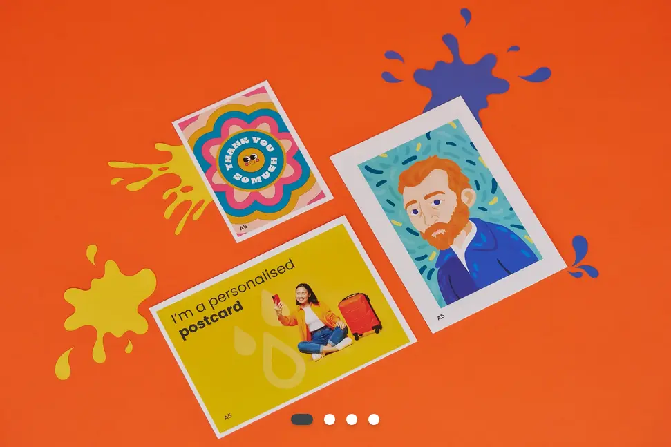 A picture of three postcards taken from far away so that you can see each design in full. One of the postcards says ' I'm a personalised postcard'.