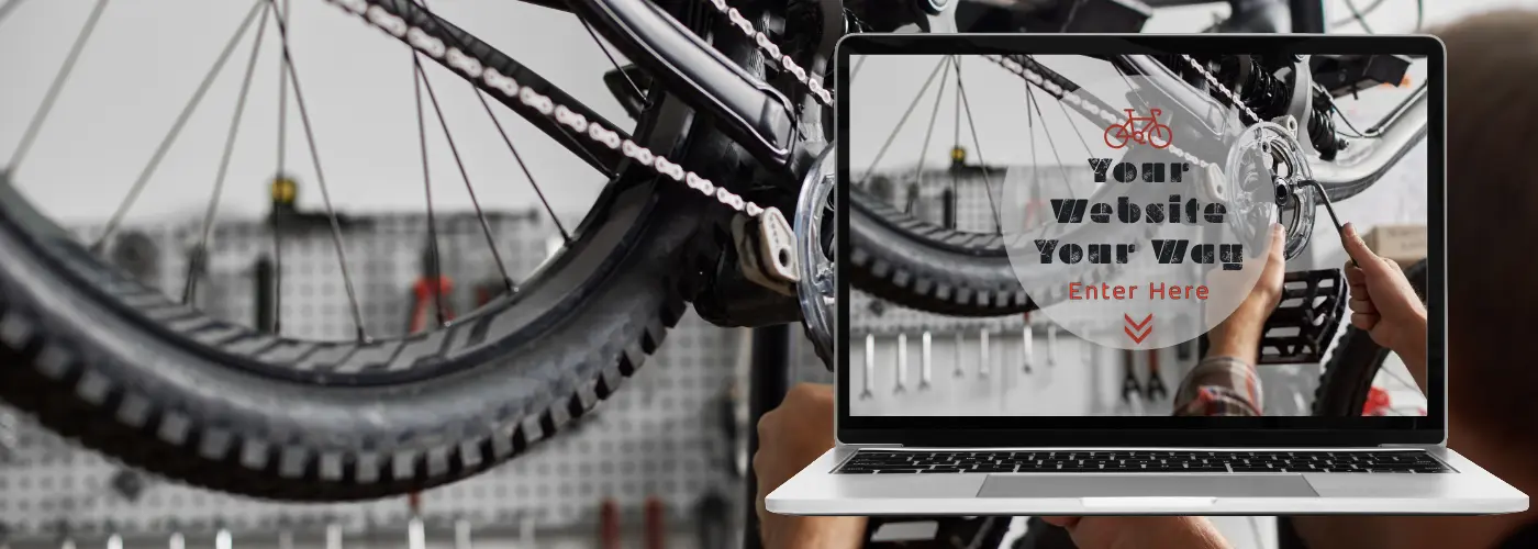 An image of a person fixing a bicycle in close up and in front is a laptop with the same picture and the words 'your website your way' in a unique design.