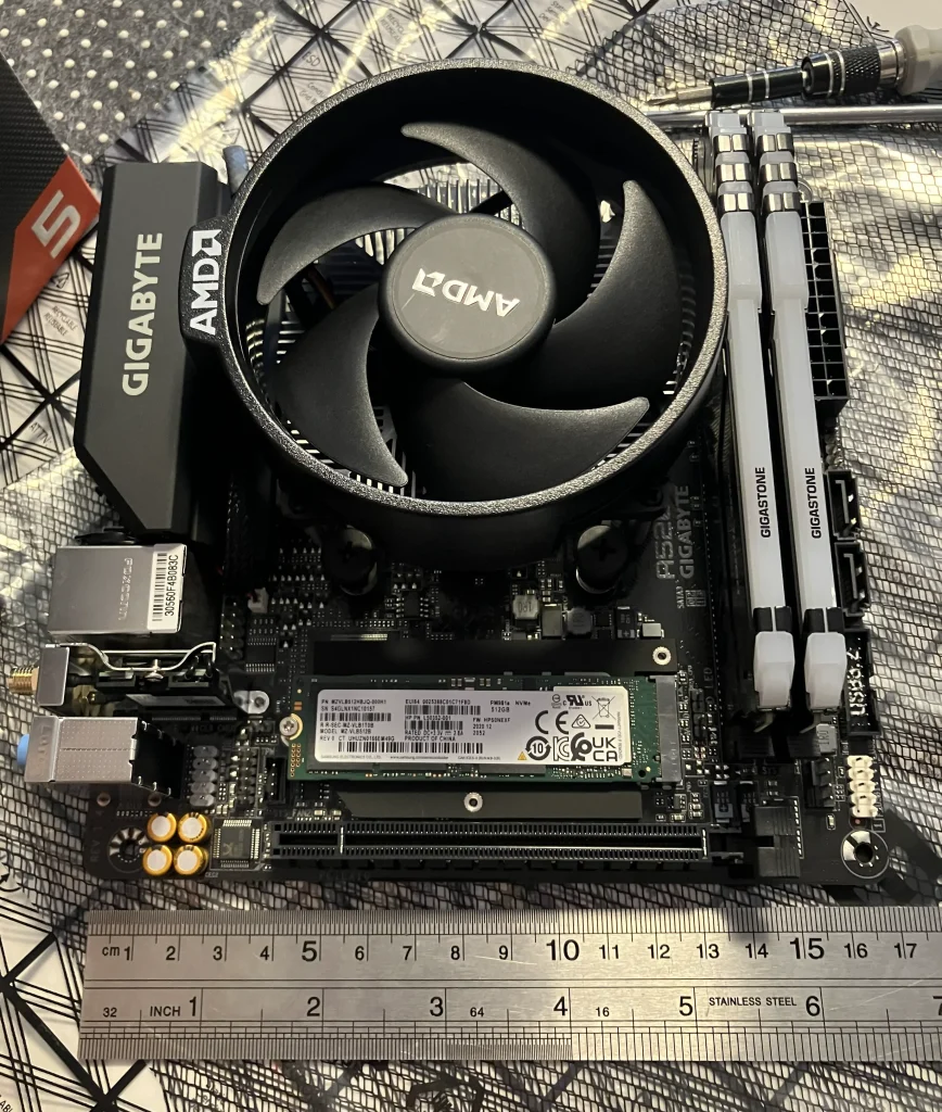 Motherboard Component installation with a ruler to give scale.