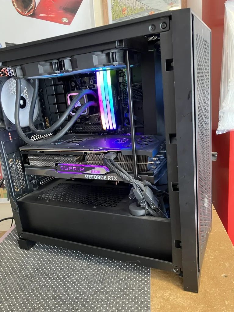 Side view of Gaming PC with glass panel removed during cleaning