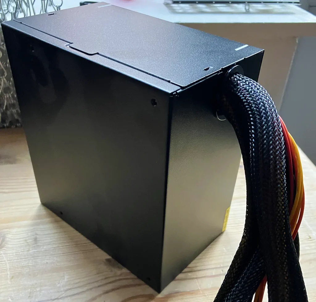 Unbranded-PSU : An image of a Budget Power Supply used in a custom built PC that failed and distributed 240 volts throughout the system causing catastrophic failures to major components
